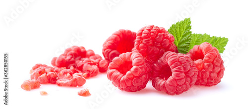 Fresh and crushed raspberries with leaves