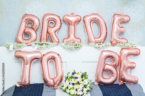 Fotografija Bride to be balloon letters sign on the bed - bridal shower concept