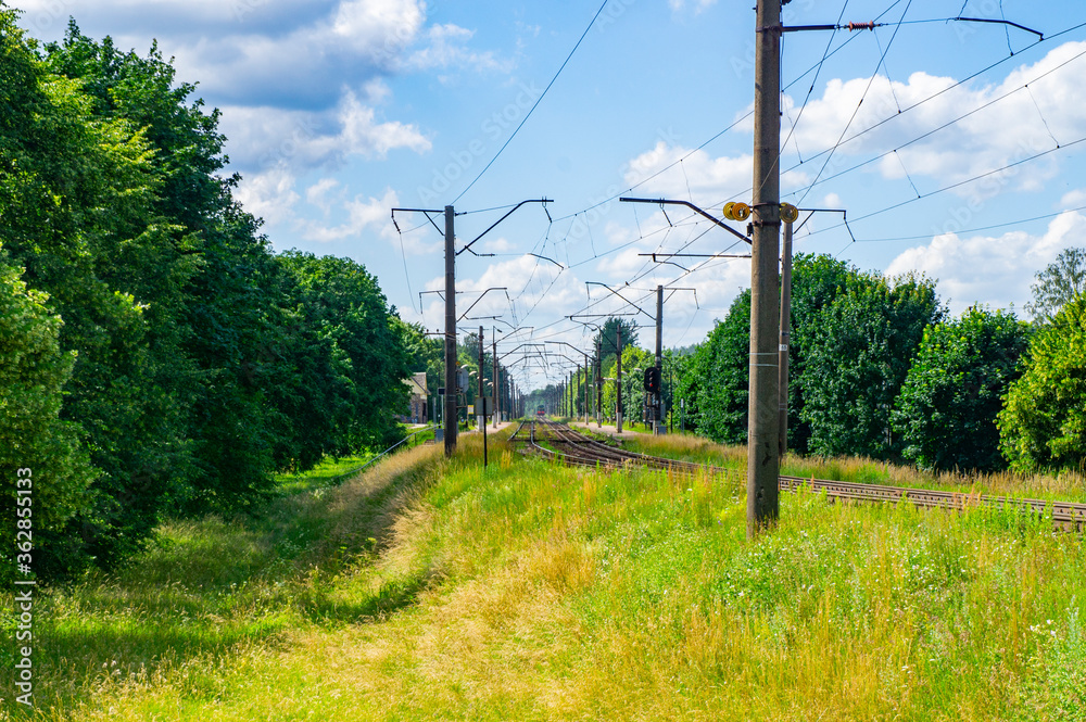 Poles with electric wires for trains and rails Poles with electric wires for trains and rails