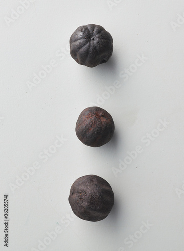 Top view shot of dried lime on white background.
loomi, limoo amani, black lime, persian lime photo