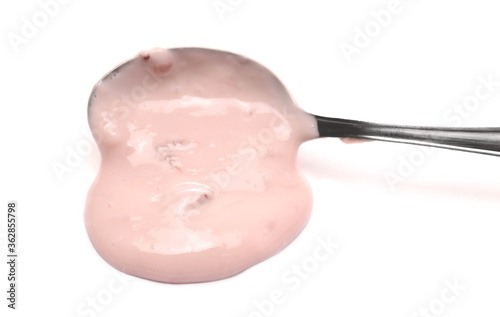 Strawberry fruit yogurt with metal spoon isolated on white background