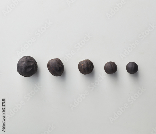 Top view shot of dried lime on white background.
loomi, limoo amani, black lime, persian lime photo