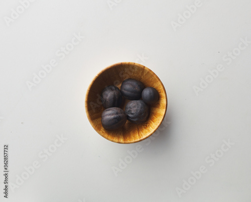 Top view shot of dried lime on white background.
loomi, limoo amani, black lime, persian lime photo