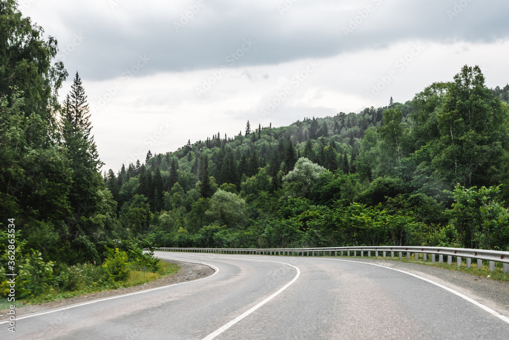 View from a moving car on a road View from a moving car on a road