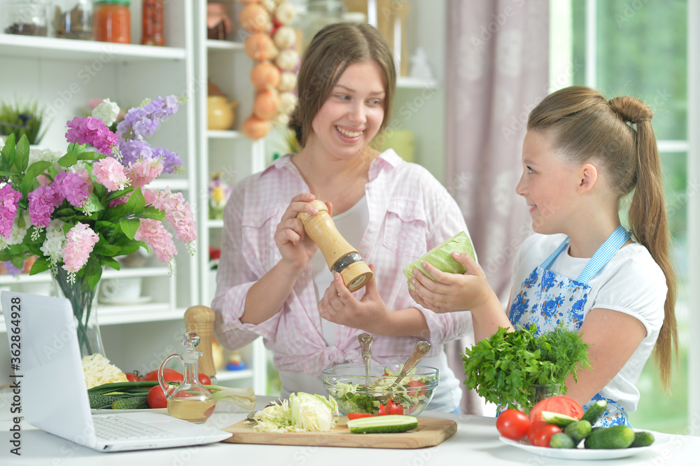 Portrait of funny girls preparing fresh salad Portrait of funny girls preparing fresh salad