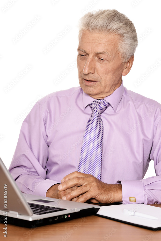 Emotional senior man in formal wear using laptop Emotional senior man in formal wear using laptop