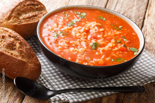 Fotografie Thick vegetarian tomato soup with rice close-up in a bowl on the table