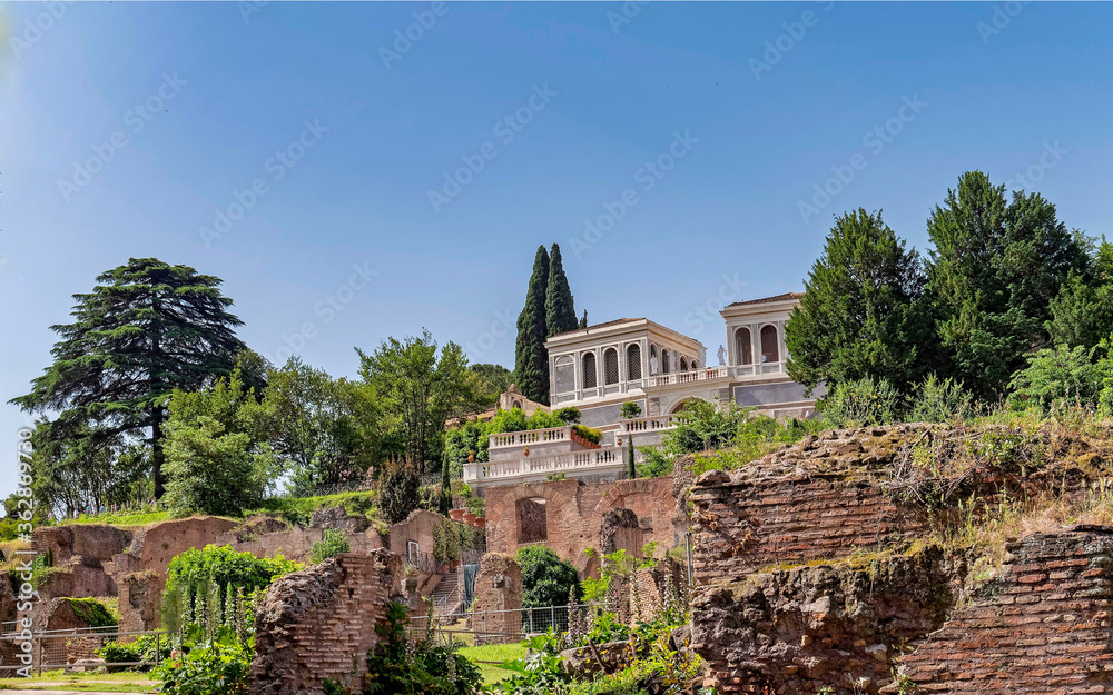 clear blue sky over the renaissance Farnese aviaries fully restored building standing between the gardens on palatine hill, Rome Italy