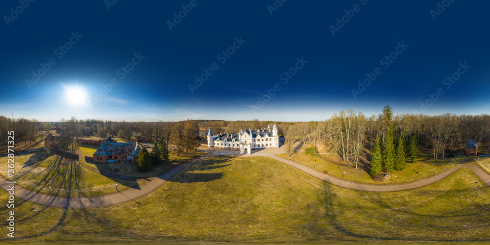 Fototapeta premium An aerial drone view of the Alatskivi Castle. Dating to the 17th century, Neo-Gothic castle situated in Alatskivi Parish, Tartu County, Estonia. 360 degrees panorama