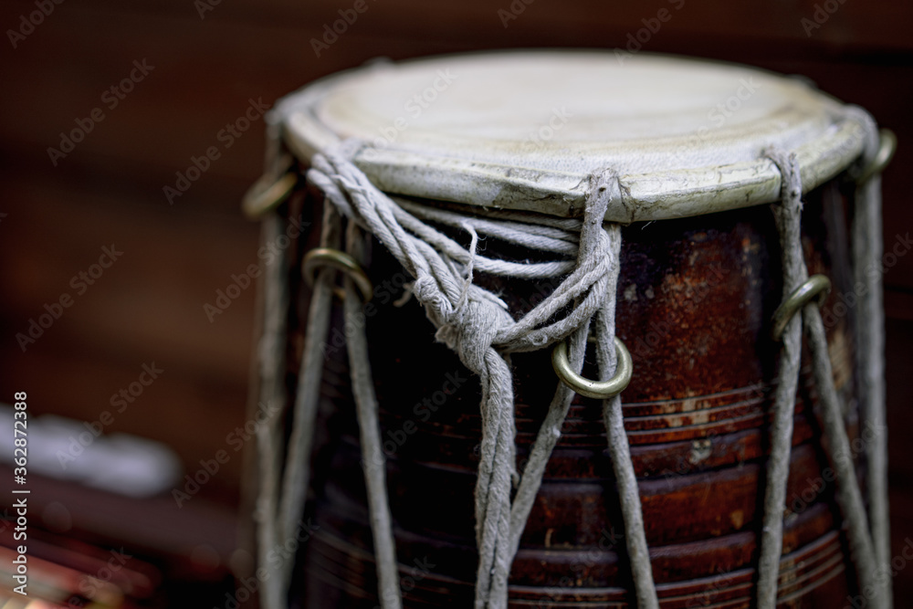 Hand drum on a wooden background