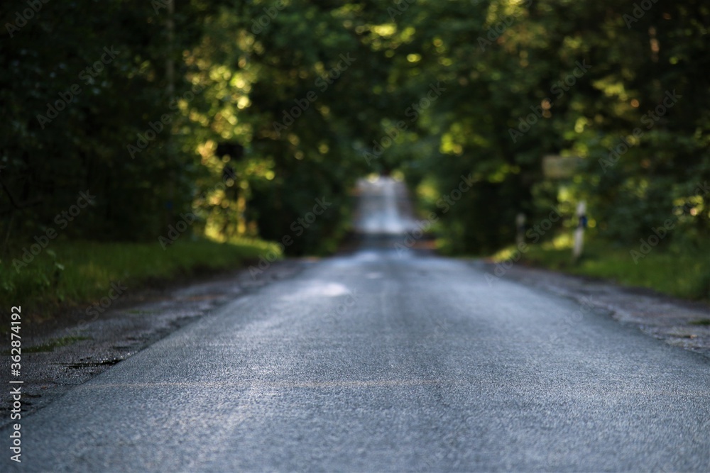 Asphalt road after the rain in the evening Asphalt road after the rain in the evening