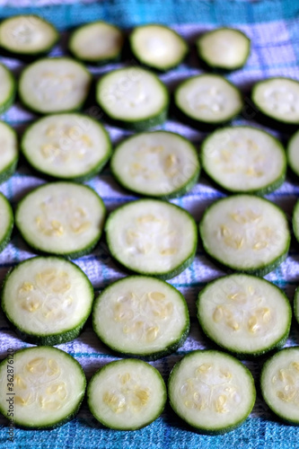 Zucchini slices, salted and prepared for cooking. Selective focus.
