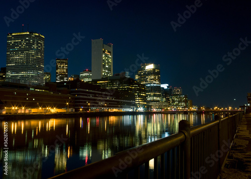 Illuminated Buildings By River Against Sky At Night #362876535