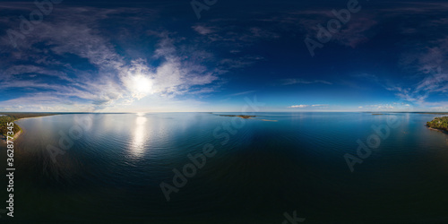 An aerial drone view of the peak of Kaberneeme Peninsula, Estonia at sunset 360 degrees panorama © 360PANO.EU