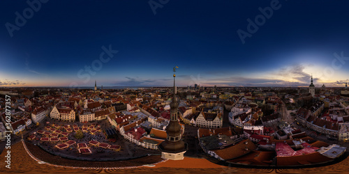 An aerial drone view of the Old Town of Tallinn, Estonia at sunset 360 degrees panorama