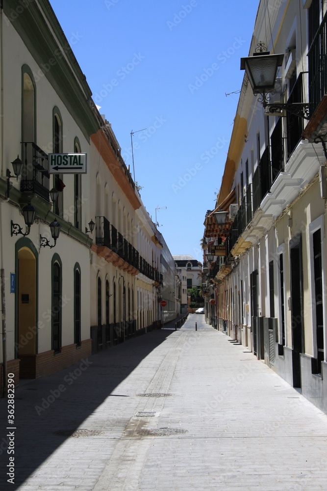 Fototapeta premium An old narrow street in the center of Seville
