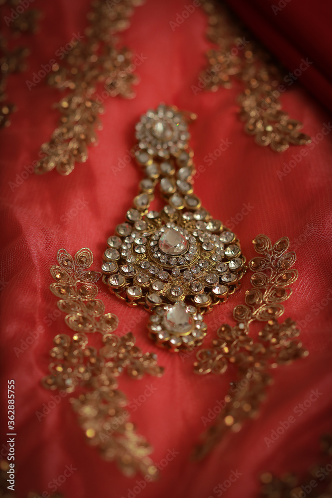 intricately designed with white stone anarkali jhoomar an head wear of the Pakistani and Indian Muslim brides intricately designed with white stone anarkali jhoomar an head wear of the Pakistani and Indian Muslim brides