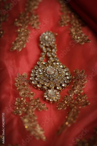 intricately designed with white stone anarkali jhoomar an head wear of the Pakistani and Indian Muslim brides