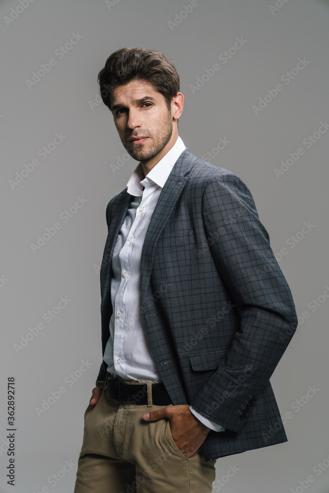 Fototapeta premium Photo of respectable confident businessman posing and looking at camera