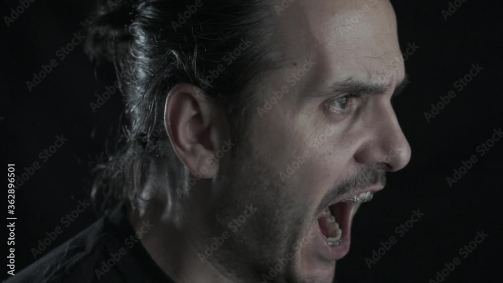 Young handsome guy with brace is screaming. Angry, depressed man is in problem. Young handsome guy with brace is screaming. Angry, depressed man is in problem.