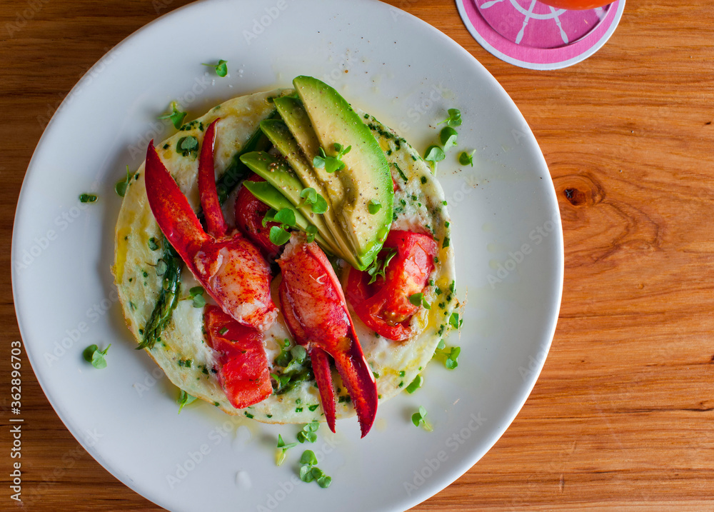 Frittata or omelette lobster avocado. Eggbased Italian dish w