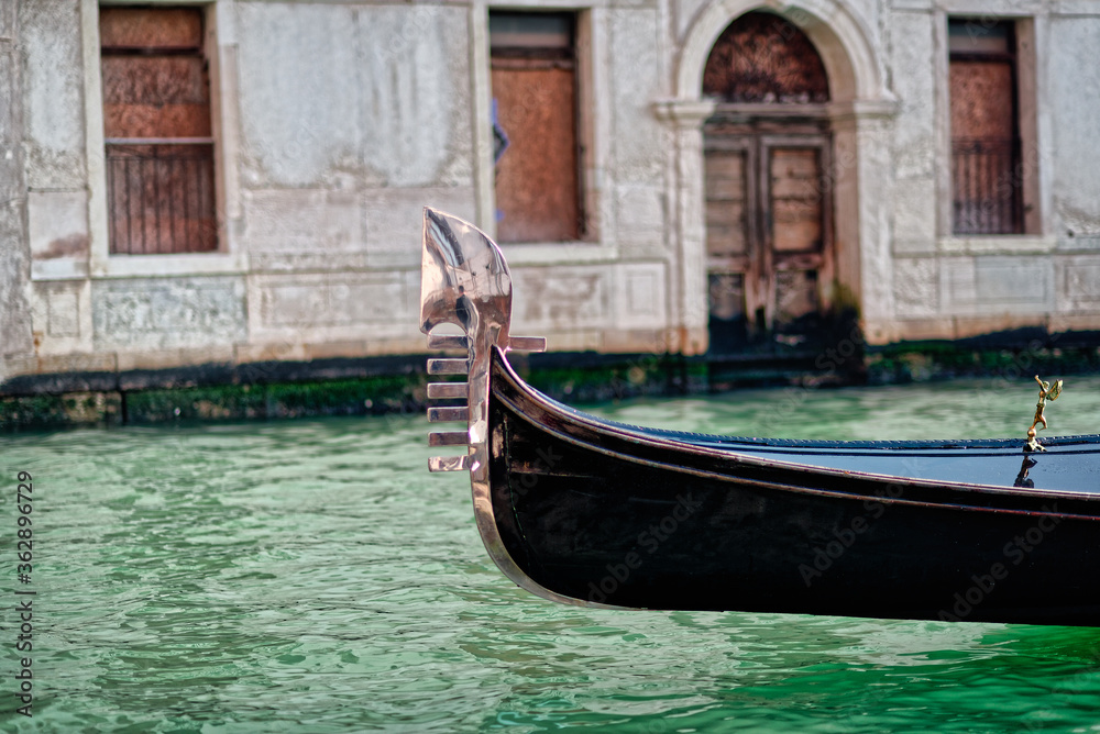 Canal with gondolas in Venice, Italy. Close-up.