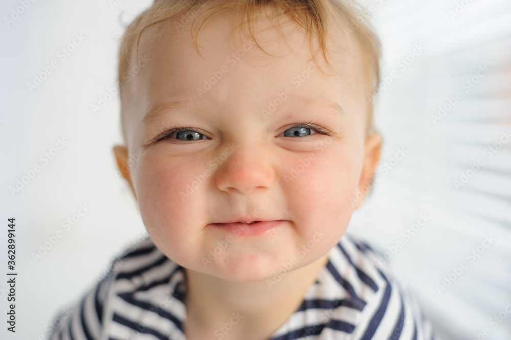 Close-up portrait of a small child. Close-up portrait of a small child.