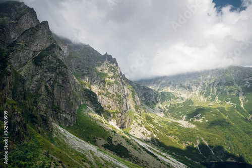 Beautiful view of rocky mountains in the clouds near the Morskie Oko lake, High Tatras, Zakopane, Poland. 