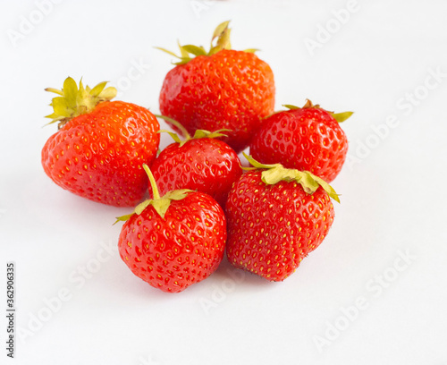 Six strawberries isolated on a white background