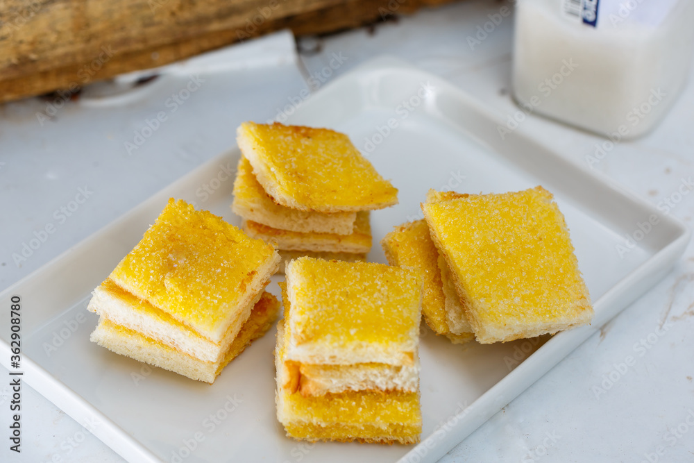 sliced toast bread with butter and sugar sliced toast bread with butter and sugar
