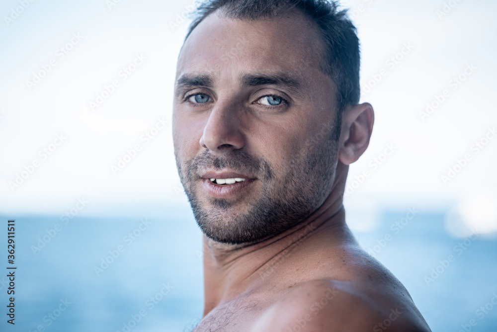 Portrait of handsome man with white teeth smile, blue eyes, surfer Portrait of handsome man with white teeth smile, blue eyes, surfer