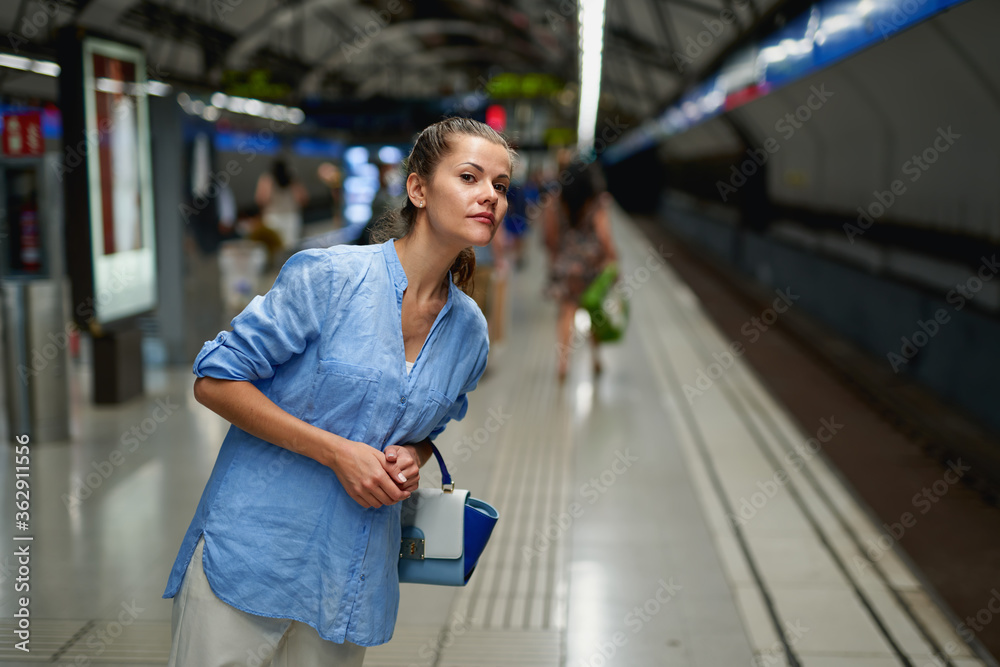 Young woman portrait inside metro subway.