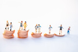 Miniature people: Group of student standing on coins with copy space using as new technology social network , study aboard and learning education concept.
