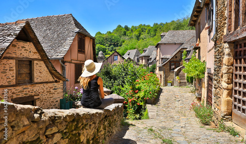 woman touriston the street-travel to Europe, village of Conques photo