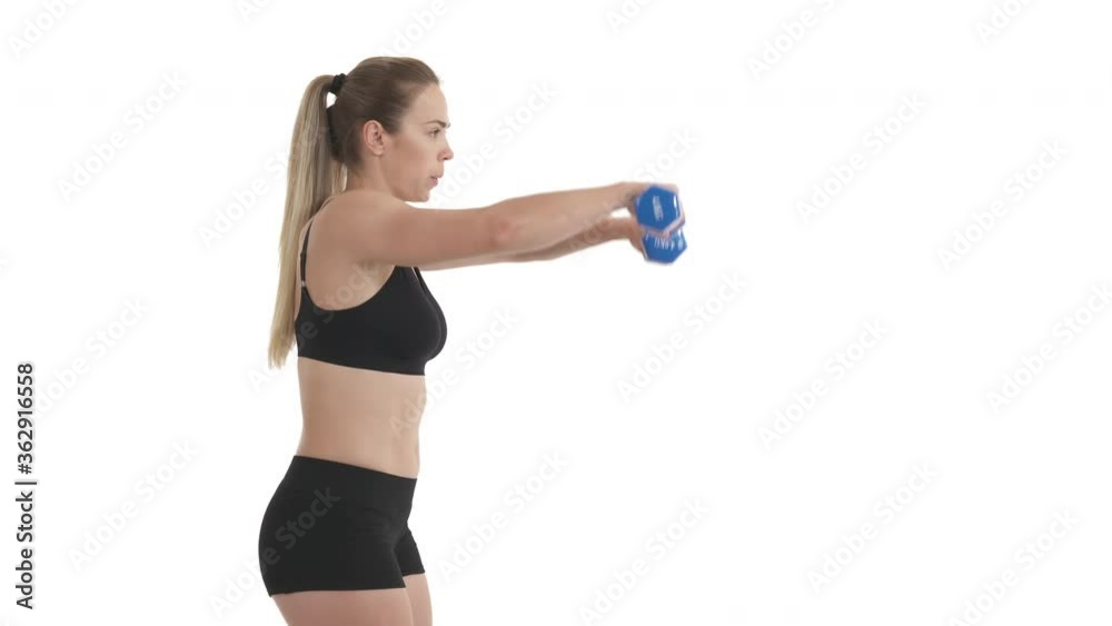 side view portrait of dumbbell delts workout of young sportswoman. Isolated on white background.