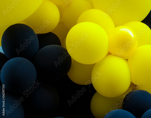 background of festive balloons in yellow and black colors