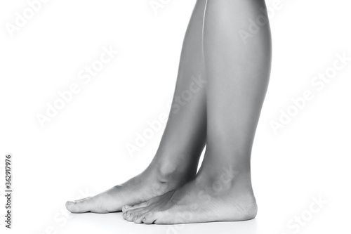 Beautiful female feet on white background, isolated