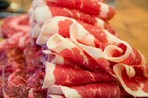 A thin roll of sliced ​​beef