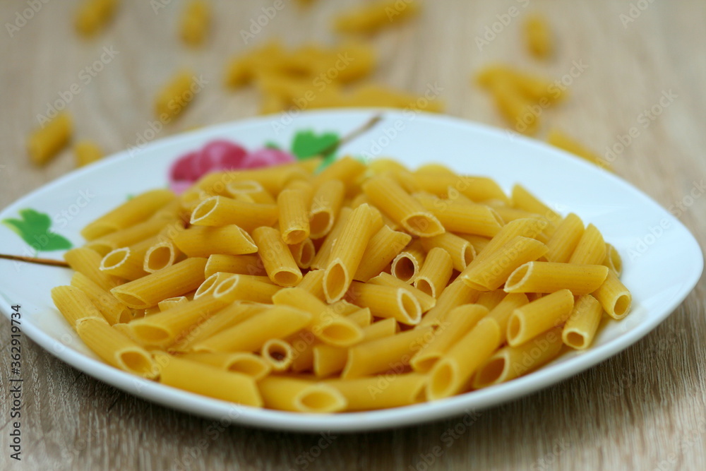 Macaroni products lying in a beautiful plate Macaroni products lying in a beautiful plate