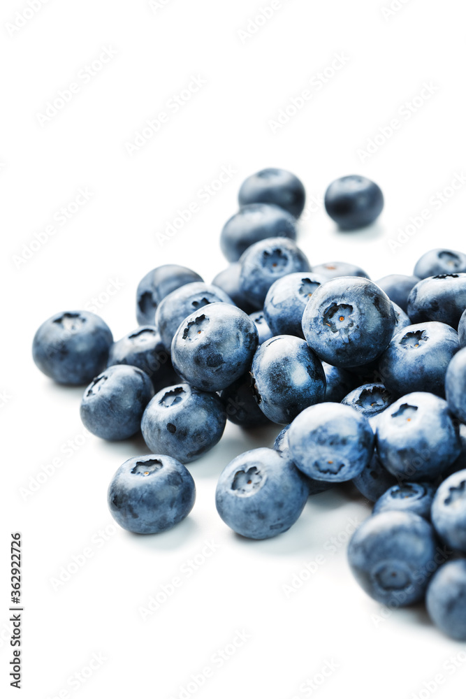 Tasty blueberries fruit are scattered on a white background. Tasty blueberries fruit are scattered on a white background.