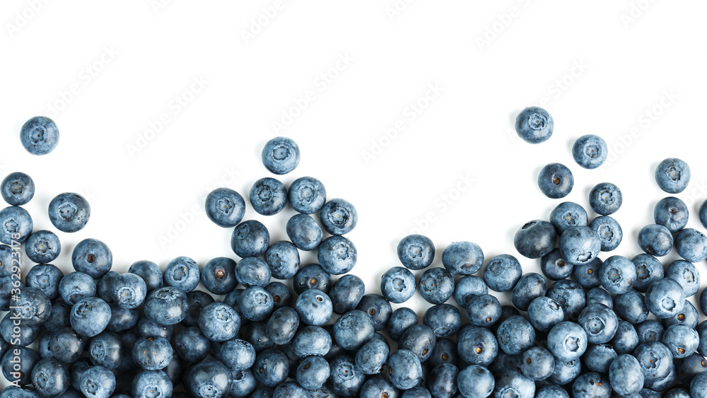 Tasty blueberries fruit are scattered on a white background. Frame Tasty blueberries fruit are scattered on a white background. Frame