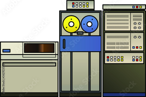 A retro mainframe computer setup with a processor cabinet, classic tape drives, and a fixed disk drive, photo