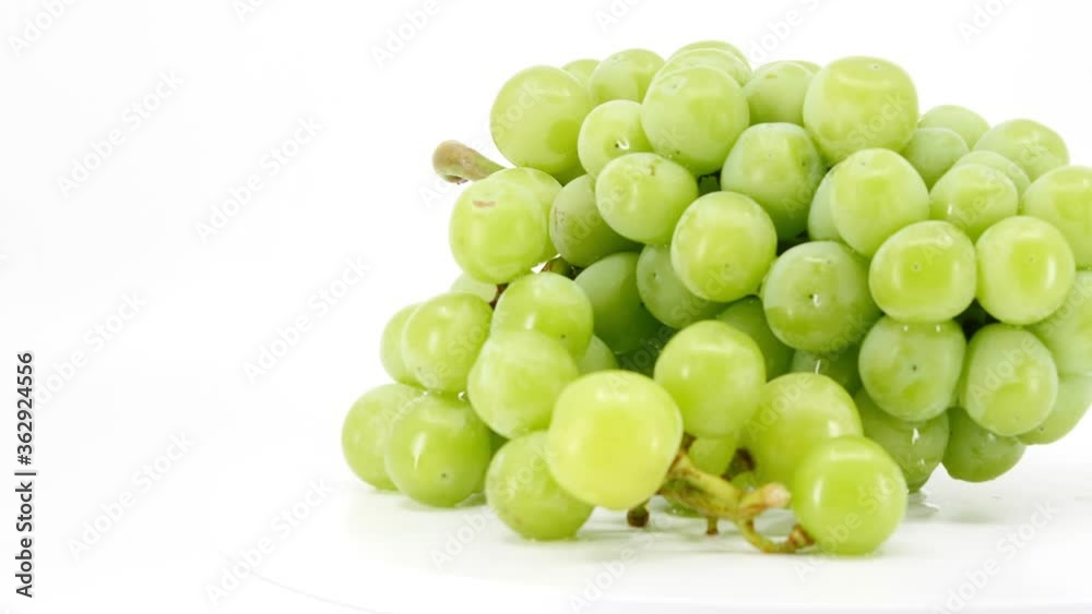 fresh green grapes fruit on white background, video footage. fresh green grapes fruit on white background, video footage.