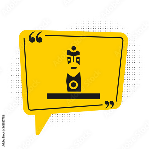 Black Slavic pagan idol icon isolated on white background. Antique ritual wooden idol. Yellow speech bubble symbol. Vector.
