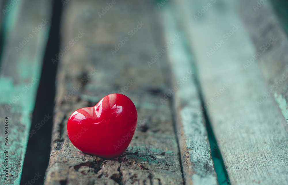 2 red hearts placed on a wooden table background in love concept for valentines day with sweet, romantic moment and valentine day greeting card. 2 red hearts placed on a wooden table background in love concept for valentines day with sweet, romantic moment and valentine day greeting card.