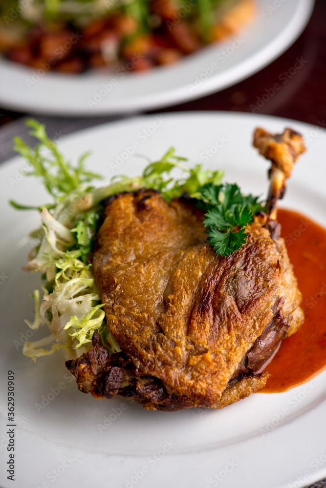 Duck. Prepared in classic French bistro style. Duck rendered in fat until skin is a crispy golden brown. Served with a frisee salad. Duck. Prepared in classic French bistro style. Duck rendered in fat until skin is a crispy golden brown. Served with a frisee salad.