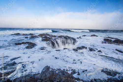 Thor's well, a big round shaped waterfall at the coast in Oregon.