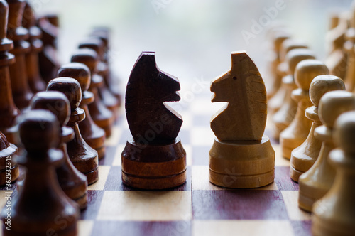 Chessmen on a chessboard, white background, Chess pieces on a chessboard