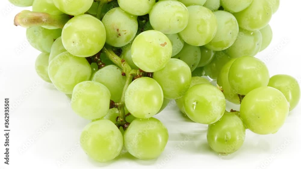 fresh green grapes fruit on white background, video footage. fresh green grapes fruit on white background, video footage.