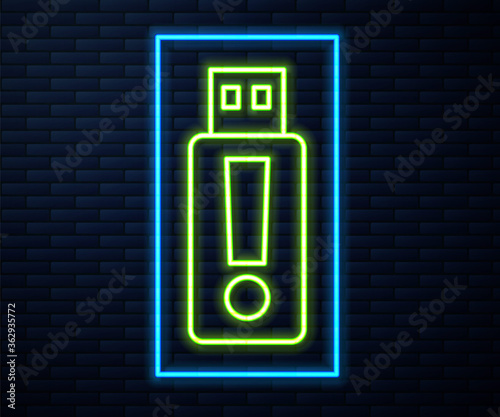 Glowing neon line USB flash drive icon isolated on brick wall background. Vector.